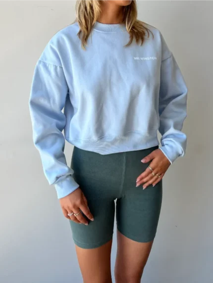 Mr. Winston 'Baby Blue' Cropped Crewneck - Elevate your casual style with this baby blue cropped crewneck from Mr. Winston, offering a trendy and comfortable addition to your wardrobe.